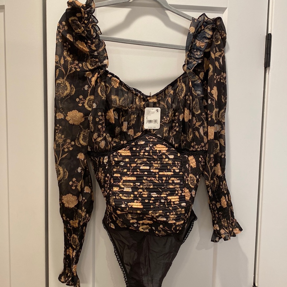 Free people bodysuit never been worn- tags still on